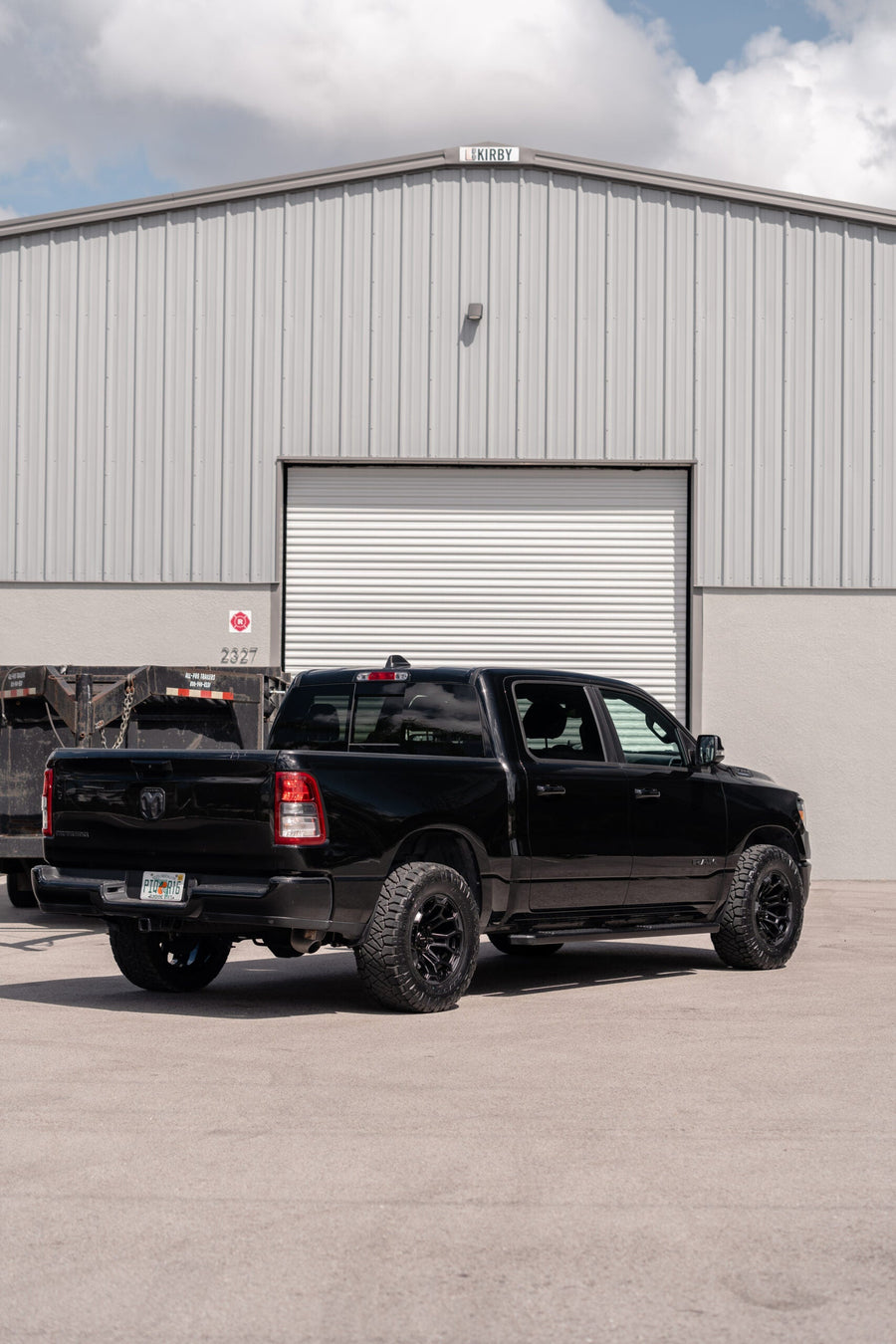 RAM 1500 DEFIANT WHEELS DF03 18X9 33X12.5X18 NITTO TIRES STOCK SUSPENSION