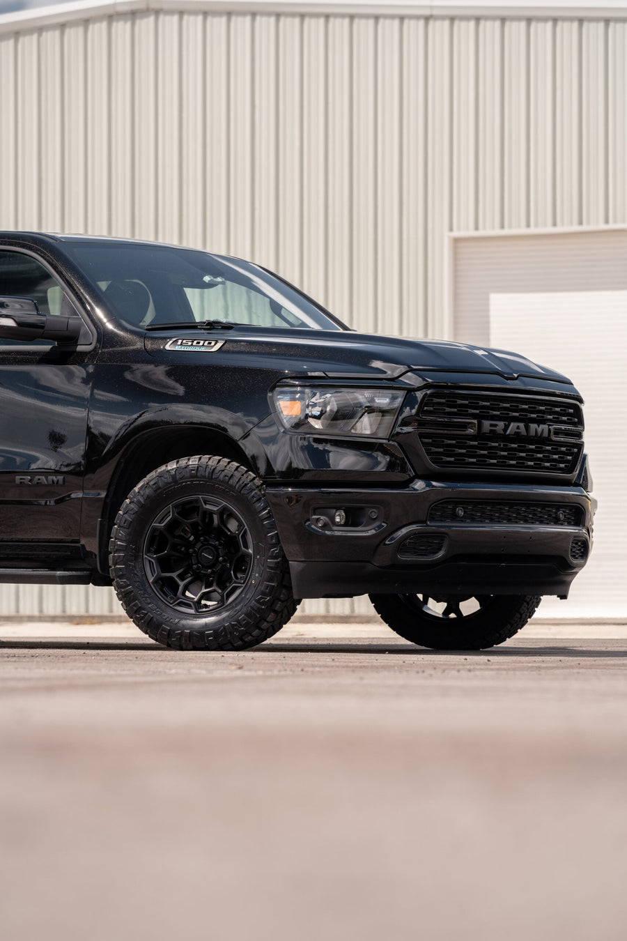 RAM 1500 DEFIANT WHEELS DF03 18X9 33X12.5X18 NITTO TIRES STOCK SUSPENSION
