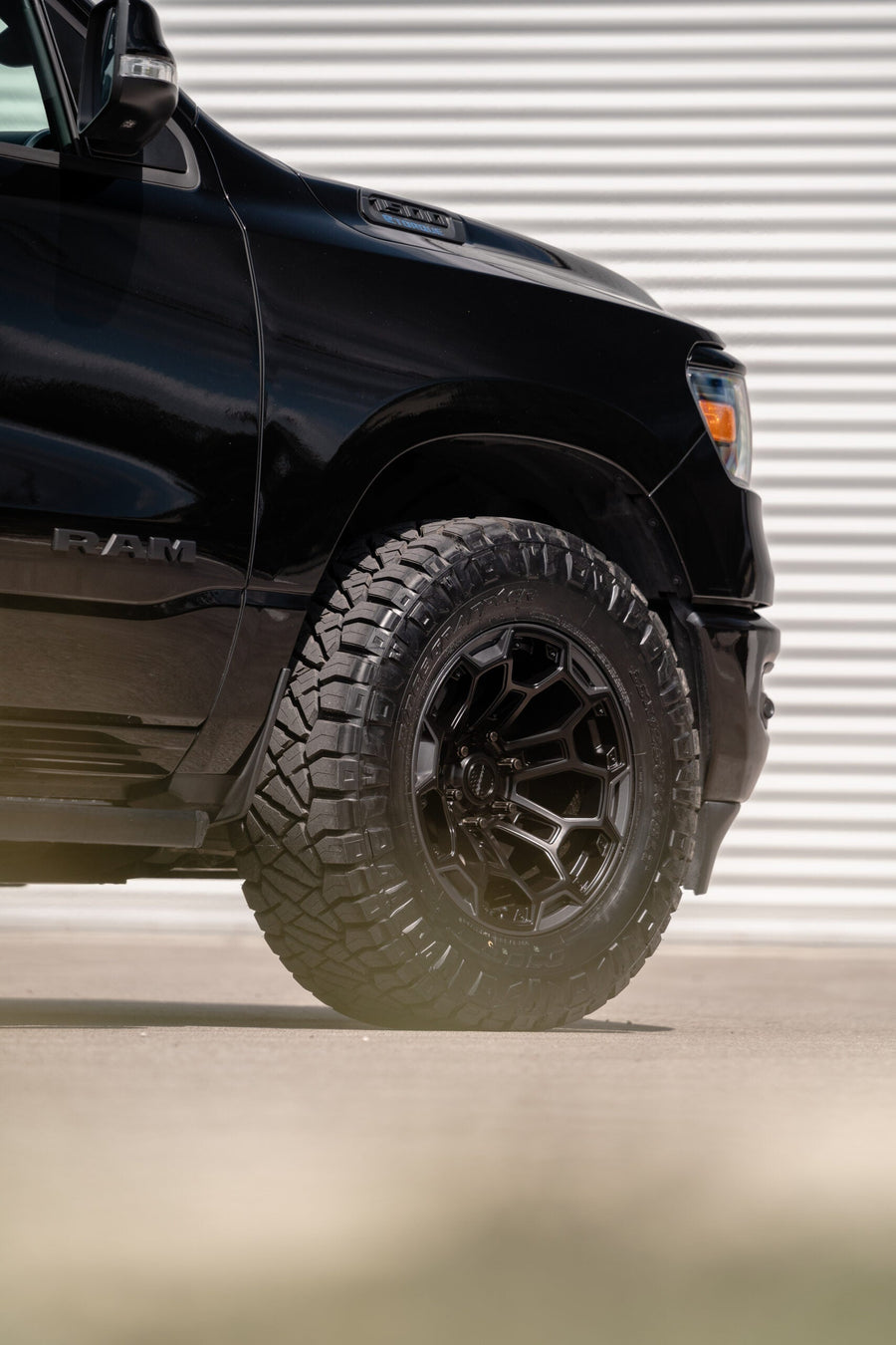 RAM 1500 DEFIANT WHEELS DF03 18X9 33X12.5X18 NITTO TIRES STOCK SUSPENSION