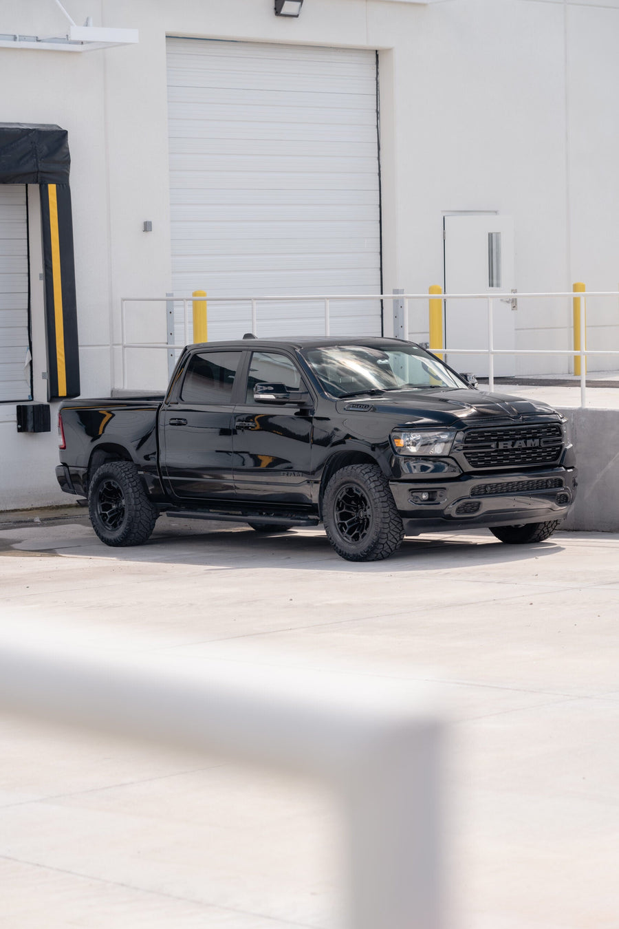 RAM 1500 DEFIANT WHEELS DF03 18X9 33X12.5X18 NITTO TIRES STOCK SUSPENSION
