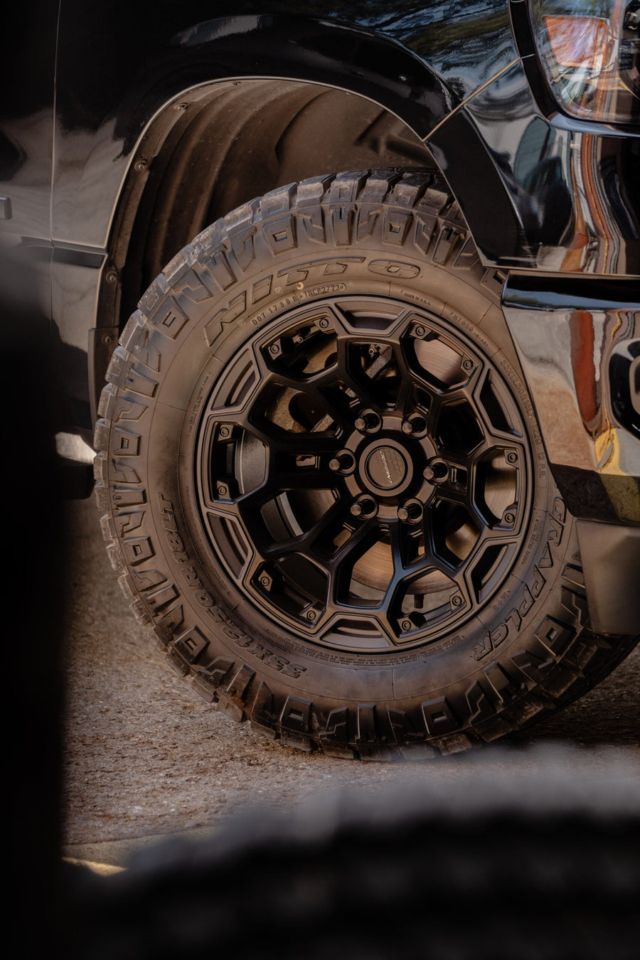 RAM 1500 DEFIANT WHEELS DF03 18X9 33X12.5X18 NITTO TIRES STOCK SUSPENSION