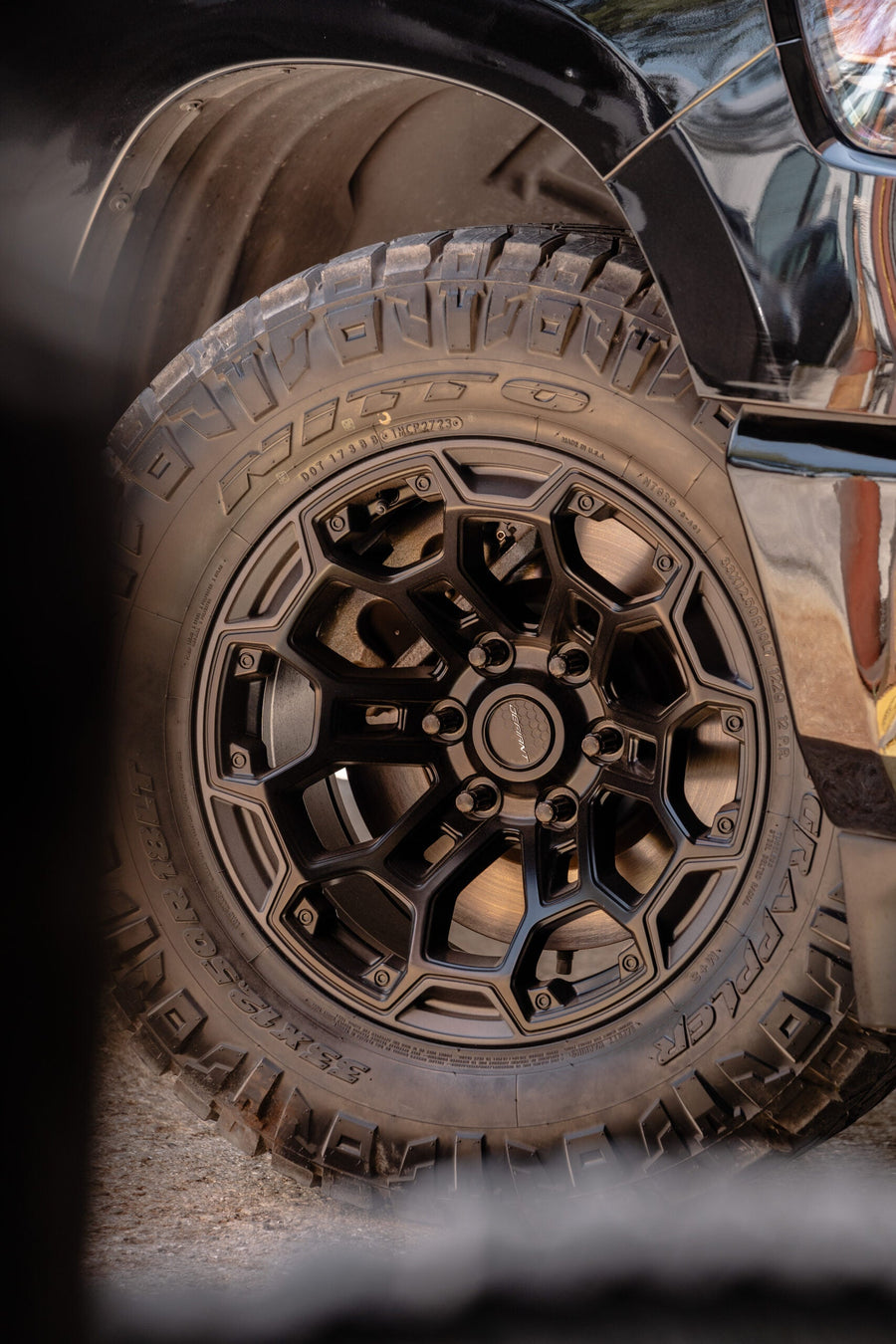 RAM 1500 DEFIANT WHEELS DF03 18X9 33X12.5X18 NITTO TIRES STOCK SUSPENSION