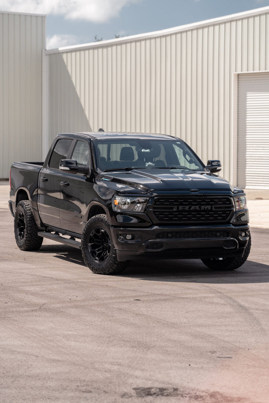 RAM 1500 DEFIANT WHEELS DF03 18X9 33X12.5X18 NITTO TIRES STOCK SUSPENSION