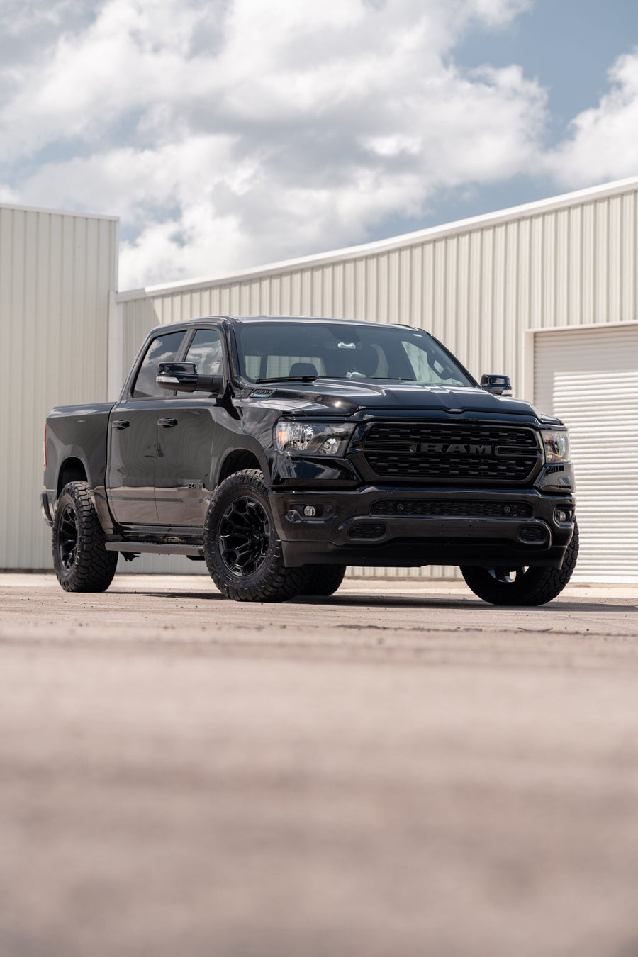 RAM 1500 DEFIANT WHEELS DF03 18X9 33X12.5X18 NITTO TIRES STOCK SUSPENSION
