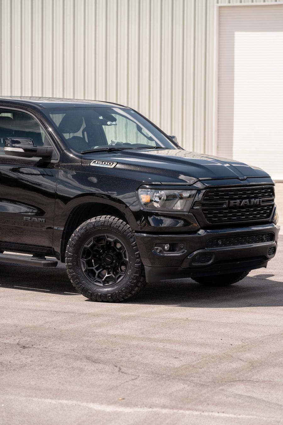 RAM 1500 DEFIANT WHEELS DF03 18X9 33X12.5X18 NITTO TIRES STOCK SUSPENSION
