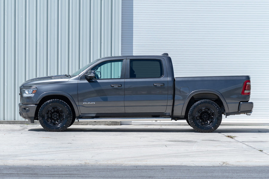 RAM 1500 DF03 DEFIANT WHEELS 18X9 33X12.5X18 NITTO TIRE STOCK SUSPENSION