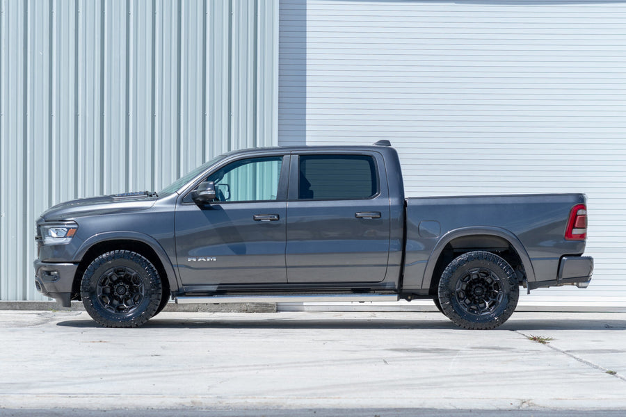 RAM 1500 DF03 DEFIANT WHEELS 18X9 33X12.5X18 NITTO TIRE STOCK SUSPENSION