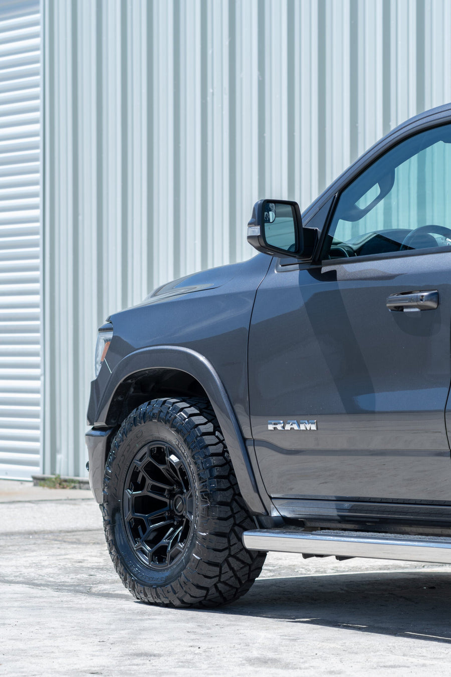 RAM 1500 DF03 DEFIANT WHEELS 18X9 33X12.5X18 NITTO TIRE STOCK SUSPENSION