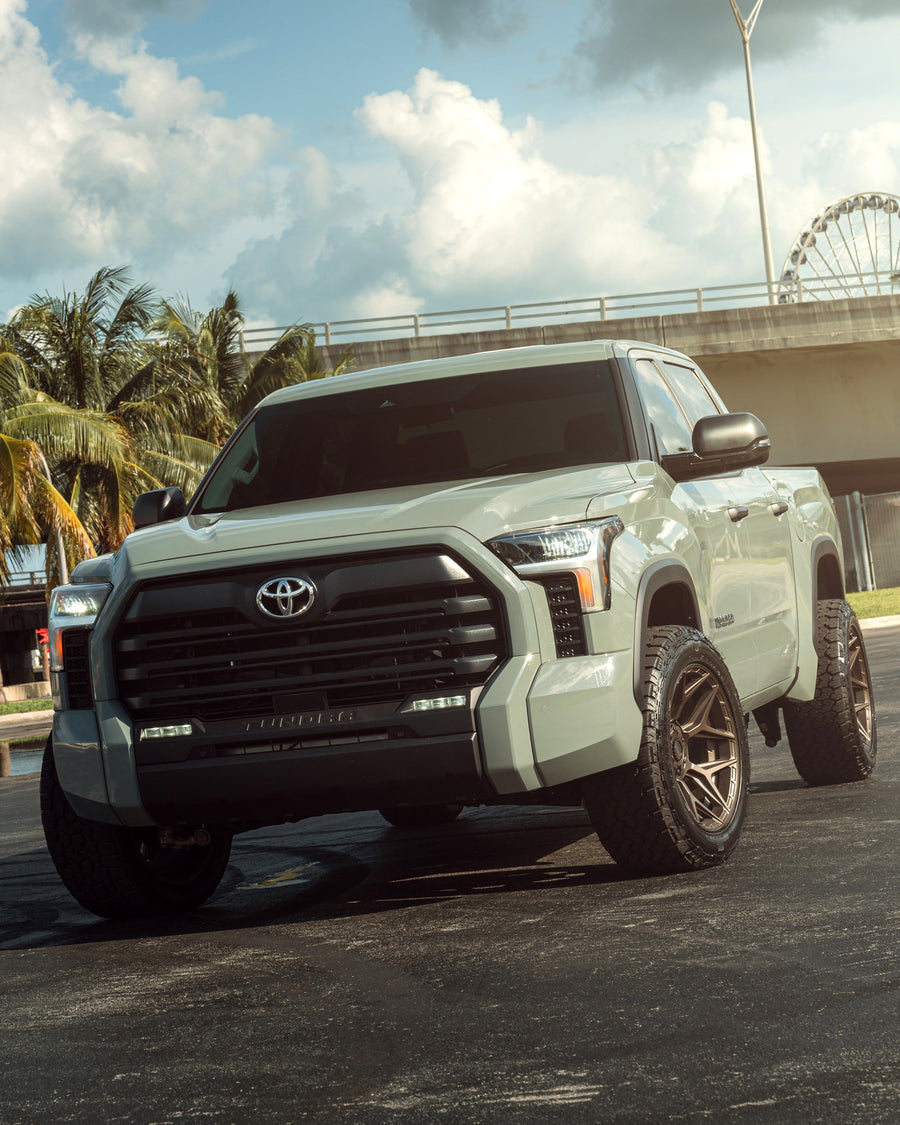 ’24 Toyota Tundra on our New 4P06 Bronze Finish with a 275-50-20 Tire on Stock Suspension