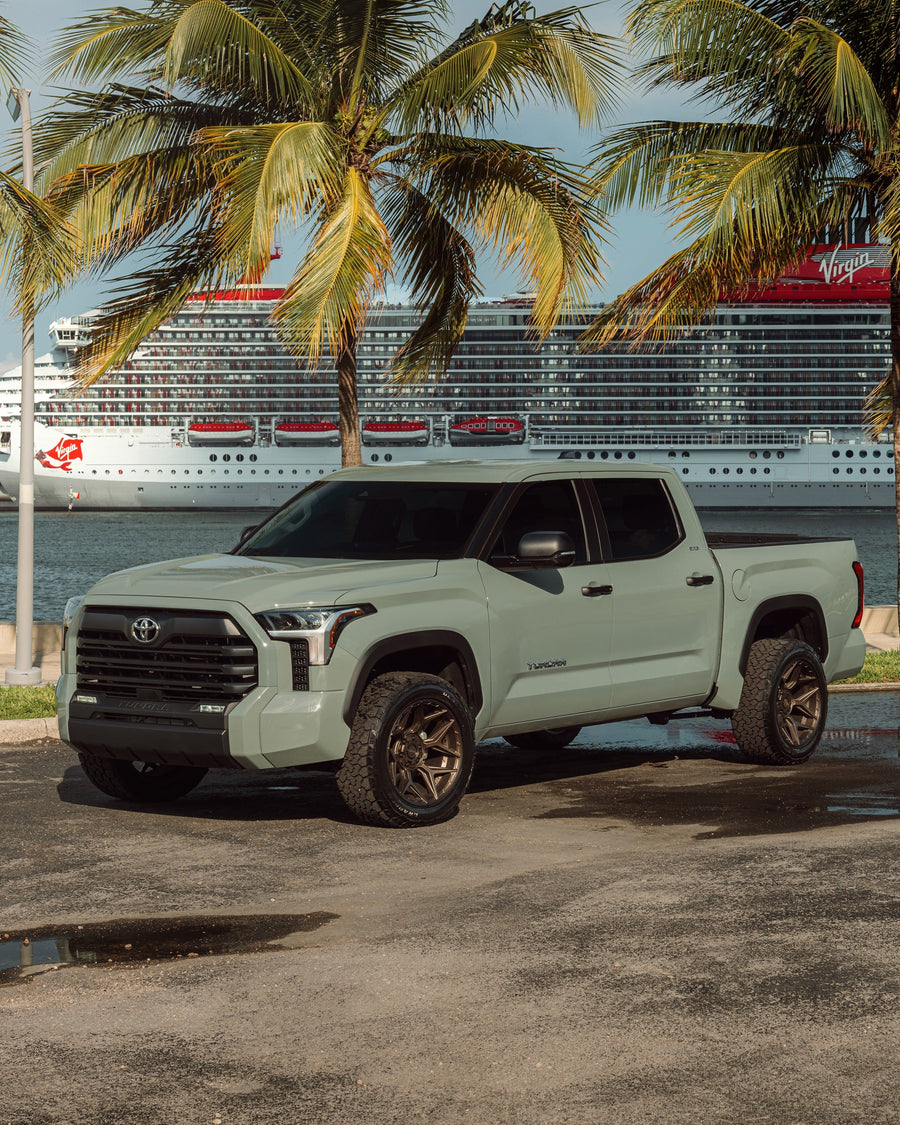 ’24 Toyota Tundra on our New 4P06 Bronze Finish with a 275-50-20 Tire on Stock Suspension