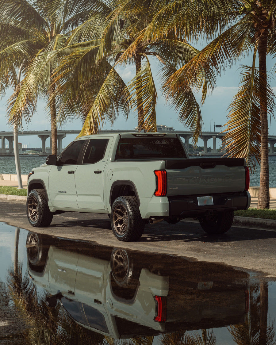 ’24 Toyota Tundra on our New 4P06 Bronze Finish with a 275-50-20 Tire on Stock Suspension