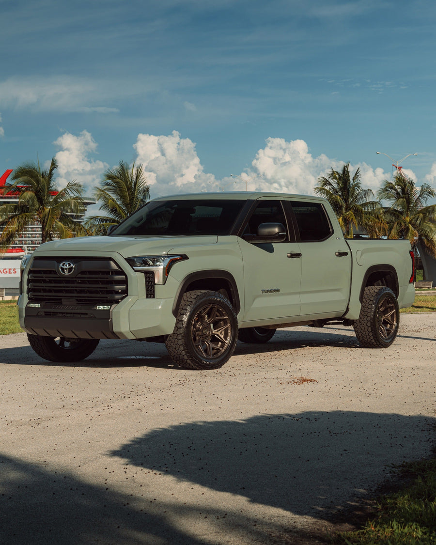 ’24 Toyota Tundra on our New 4P06 Bronze Finish with a 275-50-20 Tire on Stock Suspension