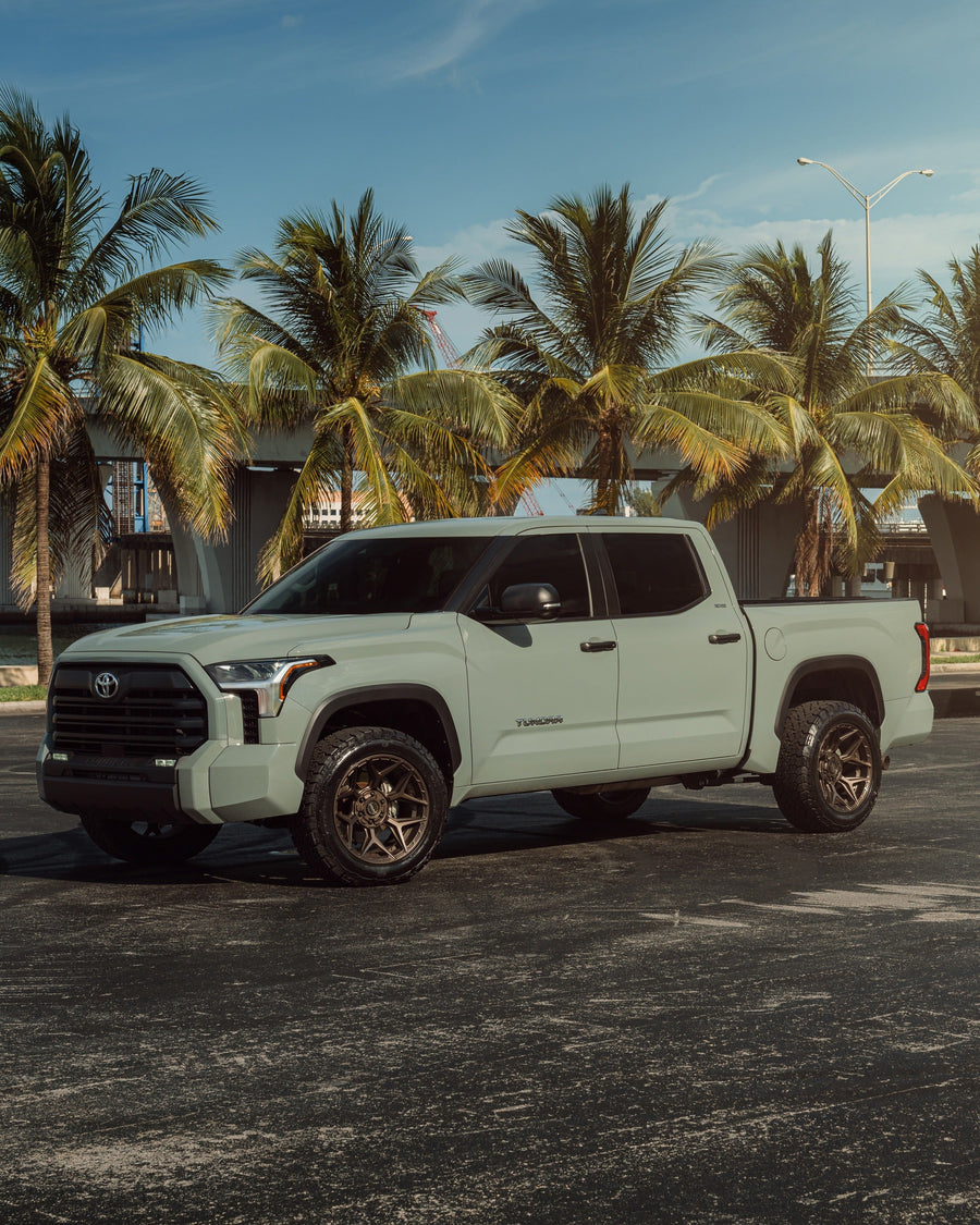 ’24 Toyota Tundra on our New 4P06 Bronze Finish with a 275-50-20 Tire on Stock Suspension