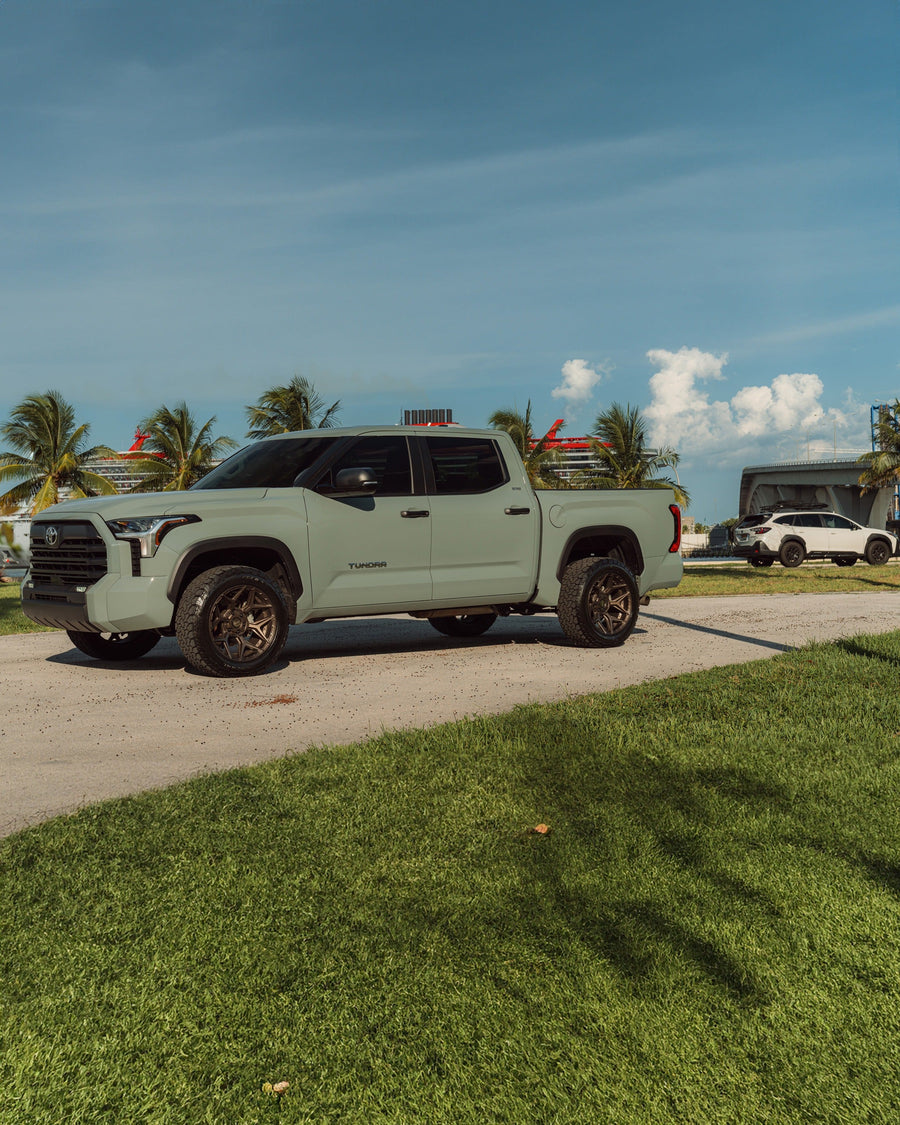 ’24 Toyota Tundra on our New 4P06 Bronze Finish with a 275-50-20 Tire on Stock Suspension